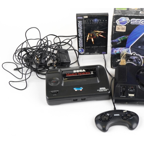 1206 - Vintage Sega games consoles and games including Sega Saturn with box, Sega Master System II and Sega... 