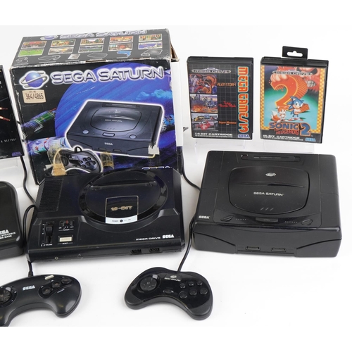 1206 - Vintage Sega games consoles and games including Sega Saturn with box, Sega Master System II and Sega... 