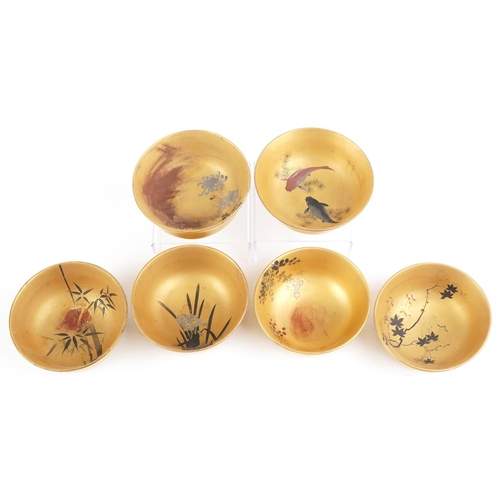 2663 - Set of six Japanese lacquered bowls hand painted with flowers and fish, each 12.5cm in diameter