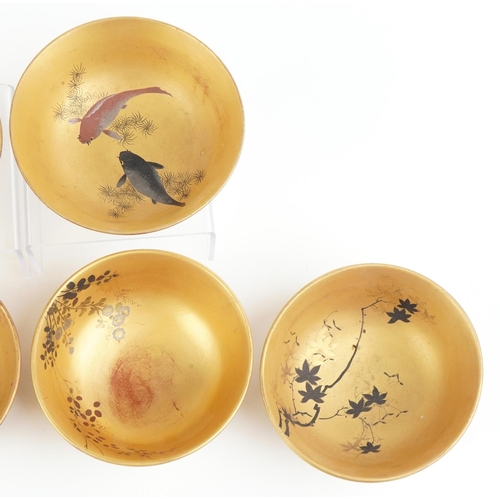 2663 - Set of six Japanese lacquered bowls hand painted with flowers and fish, each 12.5cm in diameter