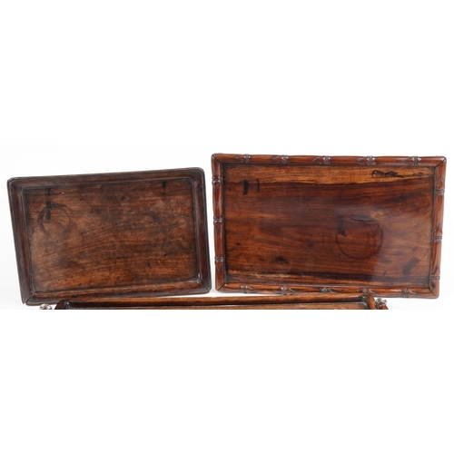 145 - Three Chinese hardwood trays, possibly Hongmu including one with twin handles having silver inlay, d... 