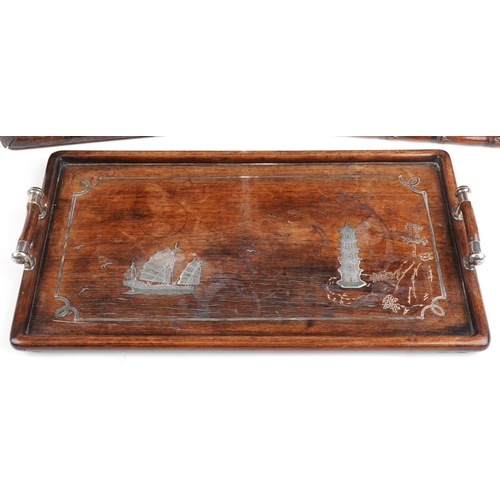 145 - Three Chinese hardwood trays, possibly Hongmu including one with twin handles having silver inlay, d... 