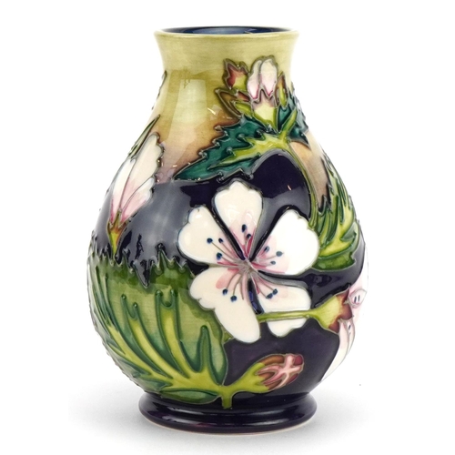 79 - Moorcroft pottery baluster vase hand painted in the Mallow pattern, painted marks to the base, 14cm ... 