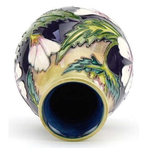 79 - Moorcroft pottery baluster vase hand painted in the Mallow pattern, painted marks to the base, 14cm ... 