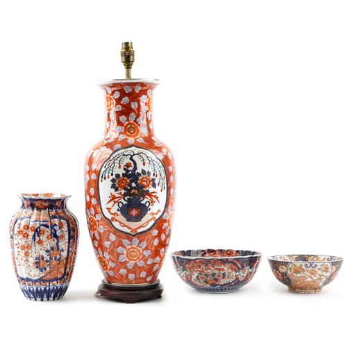 2446 - Japanese Imari porcelain including a large vase table lamp, fluted vase hand painted with flowers an... 