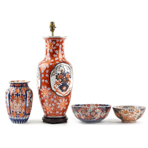 2446 - Japanese Imari porcelain including a large vase table lamp, fluted vase hand painted with flowers an... 