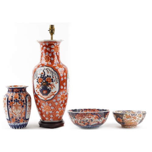 2446 - Japanese Imari porcelain including a large vase table lamp, fluted vase hand painted with flowers an... 