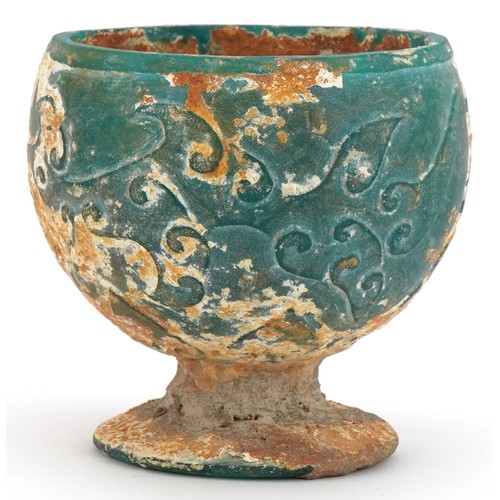 680 - Chinese turquoise glass goblet with relief decoration, 9cm high