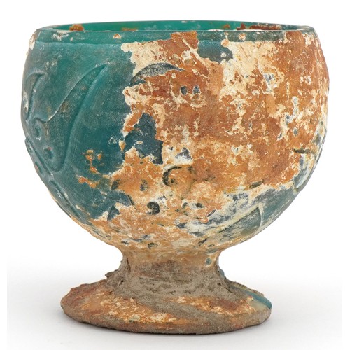 680 - Chinese turquoise glass goblet with relief decoration, 9cm high