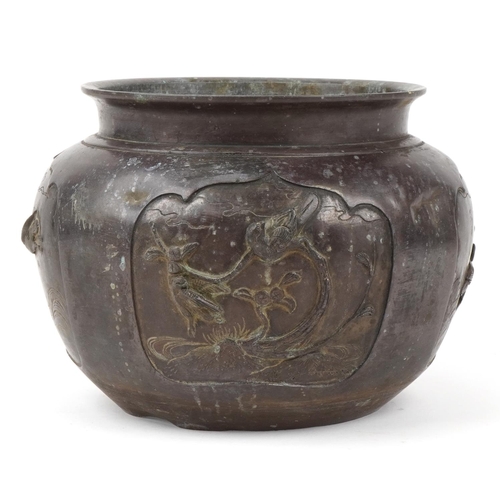 2513 - Japanese patinated bronze jardiniere decorated in relief with birds of paradise, 27cm in diameter