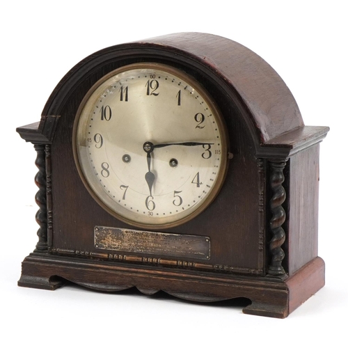 2471 - Oak cased mantle clock with silvered dial having Arabic numerals and silver presentation plaque engr... 