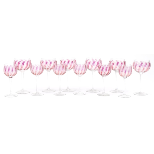 2301 - Two sets of six wine glasses with etched and cranberry decoration, the largest each 14cm high