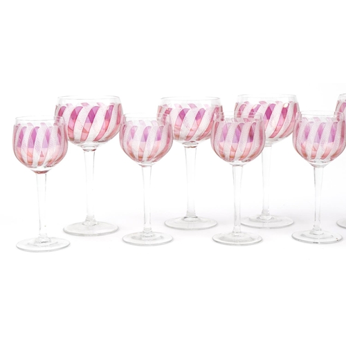 2301 - Two sets of six wine glasses with etched and cranberry decoration, the largest each 14cm high