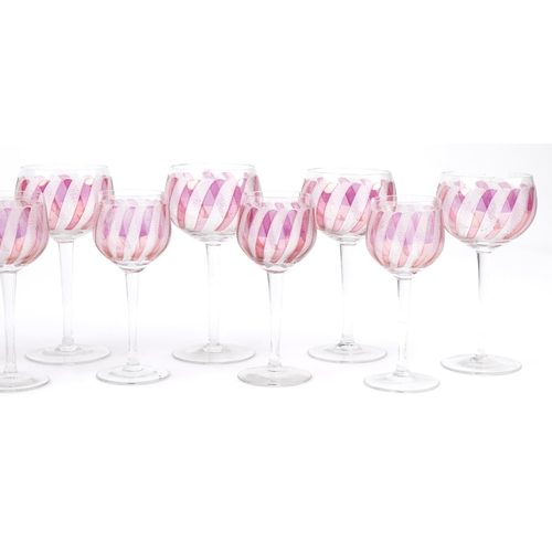 2301 - Two sets of six wine glasses with etched and cranberry decoration, the largest each 14cm high