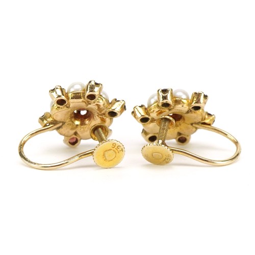 55 - Pair of 9ct gold garnet and pearl flowerhead earrings with screw backs, 1.3cm wide, 4.4g