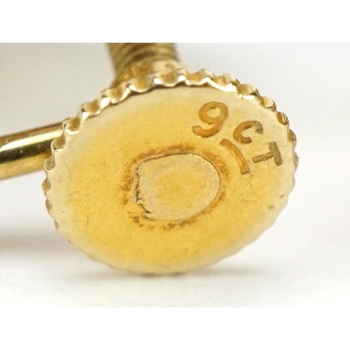 55 - Pair of 9ct gold garnet and pearl flowerhead earrings with screw backs, 1.3cm wide, 4.4g