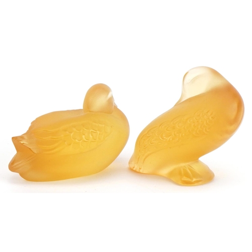 88 - Lalique, two French frosted amber glass duck paperweights, each with paper labels and etched Lalique... 