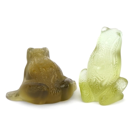 86 - Lalique, two French frosted green glass frog paperweights, one with paper label, each etched Lalique... 