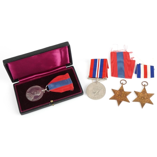 1365 - Three British military World War II medals and a George V Faithful Service medal with fitted case aw... 