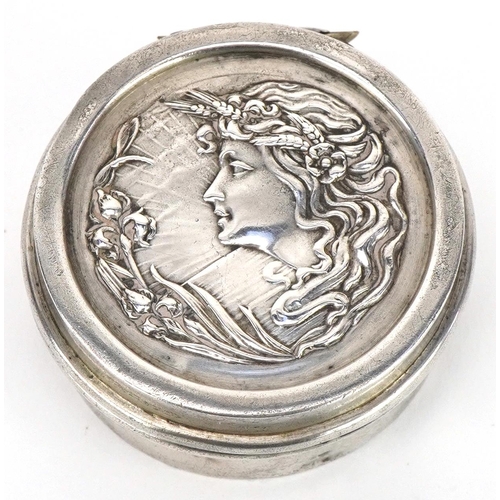 561 - Henry Matthews, Art Nouveau circular silver patch box, the hinged lid embossed with a maiden, Birmin... 