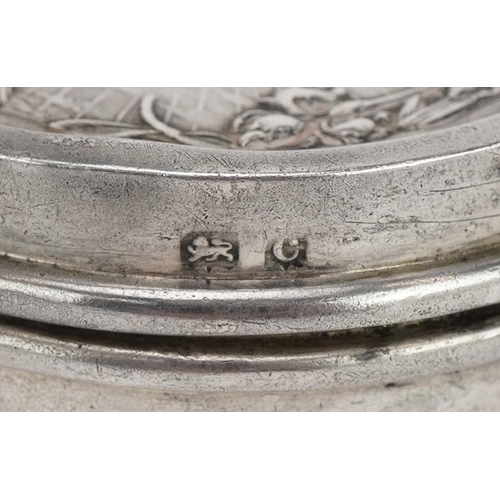 561 - Henry Matthews, Art Nouveau circular silver patch box, the hinged lid embossed with a maiden, Birmin... 