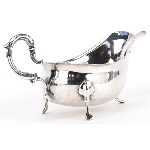 130 - William Hutton & Sons Ltd, George V silver three footed sauceboat, Birmingham 1919, 19.5cm wide, 199... 