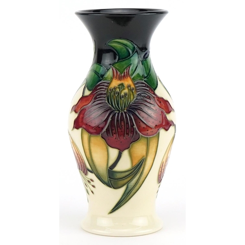 76 - Moorcroft pottery baluster vase hand painted in the Anna Lilly pattern, 19.5cm high