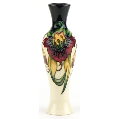 77 - Moorcroft pottery baluster vase hand painted in the Anna Lilly pattern, 21cm high