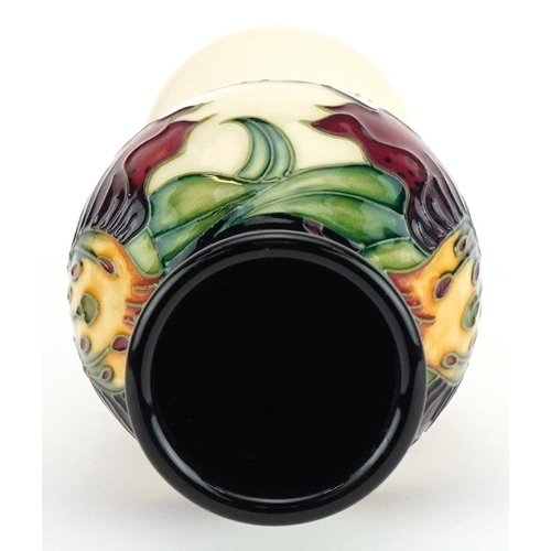 77 - Moorcroft pottery baluster vase hand painted in the Anna Lilly pattern, 21cm high