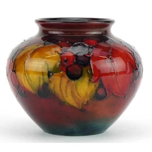 William Moorcroft pottery flambe vase hand painted in the Leaves and Berry pattern, impressed and painted marks to the base, 9cm high