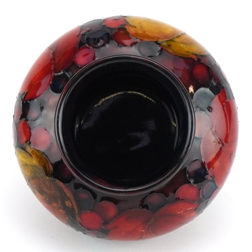 12 - William Moorcroft pottery flambe vase hand painted in the Leaves and Berry pattern, impressed and pa... 