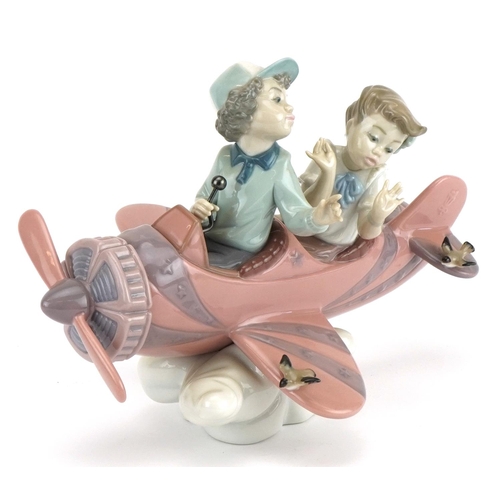 2245 - Lladro figure group of a young boy and girl in an aeroplane, Don't Look Down, numbered 5698, 23cm wi... 