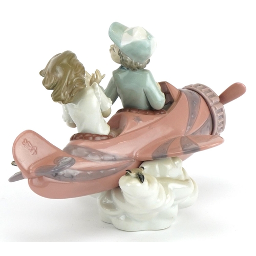 2245 - Lladro figure group of a young boy and girl in an aeroplane, Don't Look Down, numbered 5698, 23cm wi... 