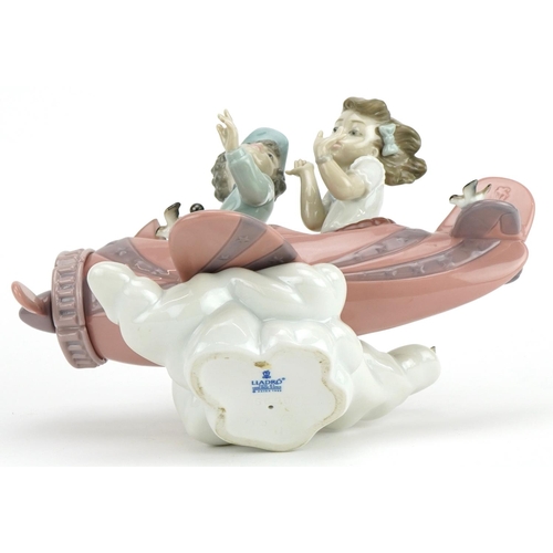 2245 - Lladro figure group of a young boy and girl in an aeroplane, Don't Look Down, numbered 5698, 23cm wi... 