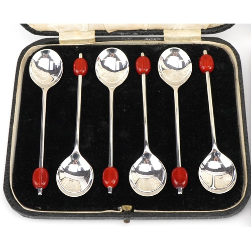 490 - Three sets of silver spoons with cases comprising set of six apostle teaspoons housed in a Harrods f... 