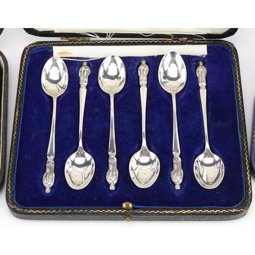 490 - Three sets of silver spoons with cases comprising set of six apostle teaspoons housed in a Harrods f... 