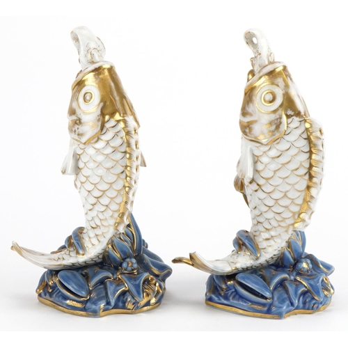 253 - Pair of 19th century continental porcelain scent bottles with stoppers in the form of fish, each 17c... 