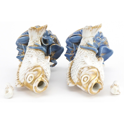 253 - Pair of 19th century continental porcelain scent bottles with stoppers in the form of fish, each 17c... 