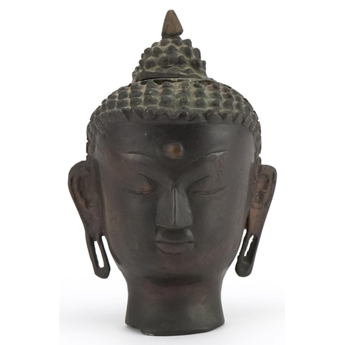 396 - Chino Tibetan patinated bronze Buddha head, 19.5cm high