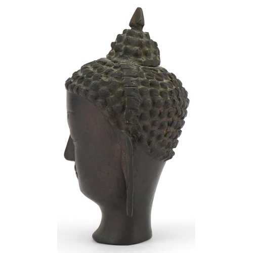 396 - Chino Tibetan patinated bronze Buddha head, 19.5cm high