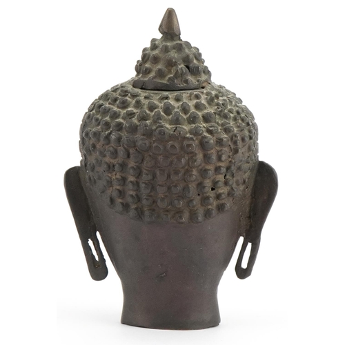 396 - Chino Tibetan patinated bronze Buddha head, 19.5cm high