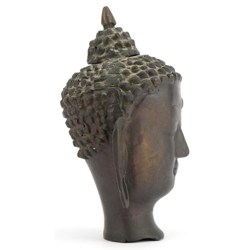 396 - Chino Tibetan patinated bronze Buddha head, 19.5cm high