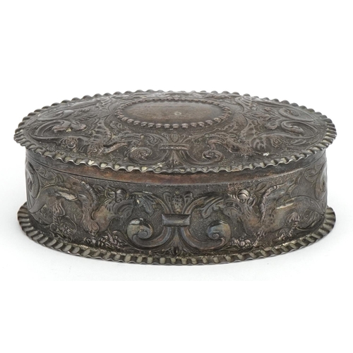7 - WITHDRAWN George III oval silver box with hinged lid profusely embossed with dragons and floral moti... 