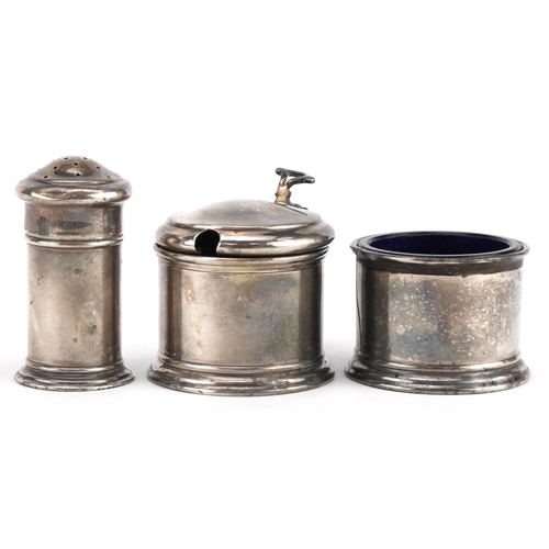 636 - Docker & Burn, George V silver three piece cruet set with blue glass liners housed in a fitted case,... 