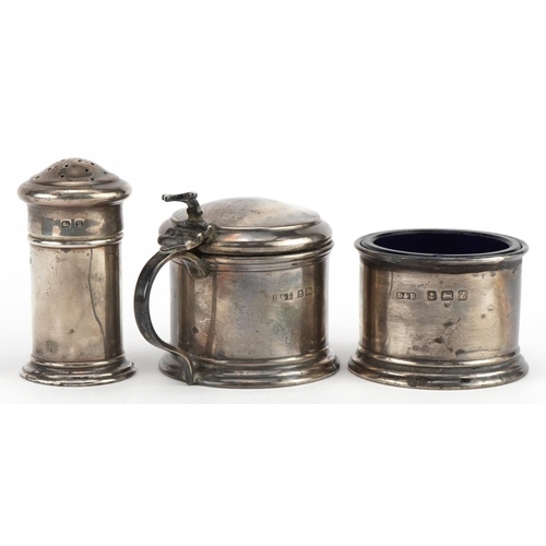 636 - Docker & Burn, George V silver three piece cruet set with blue glass liners housed in a fitted case,... 