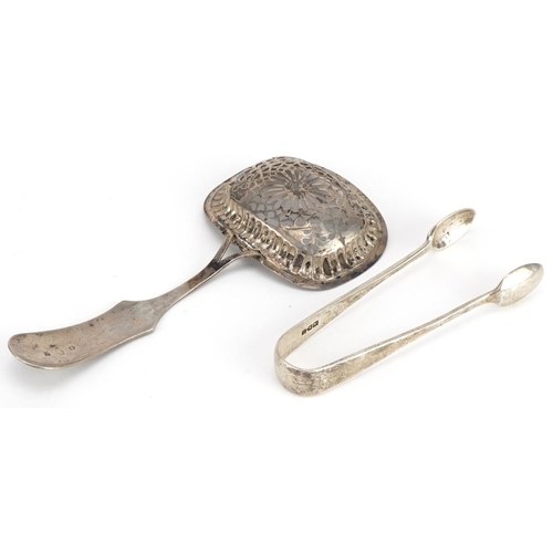 449 - Dutch silver sifting spoon and a pair of silver sugar tongs, the largest 16.5cm in length, total 66.... 