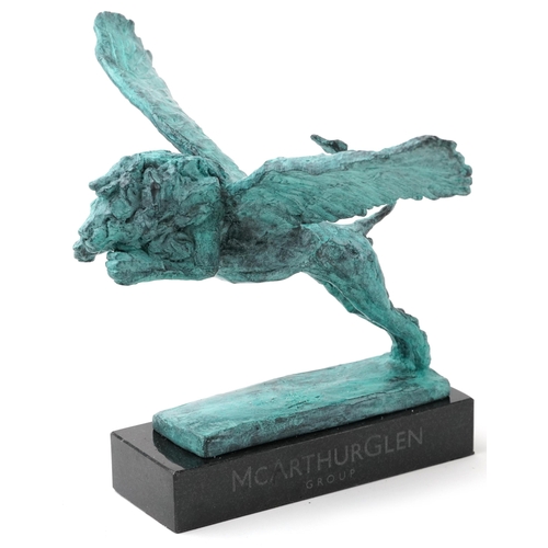 545 - Mark Coreth for McArthur Glen Group, Verdigris bronze statue of a winged lion raised on a slate base... 