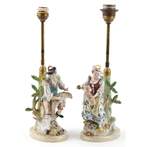 245 - Dresden, pair of German floral encrusted porcelain table lamps in the form of a shepherd and shepher... 