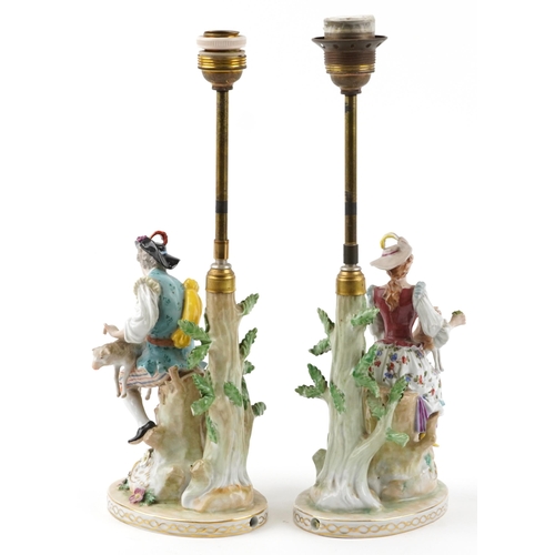 245 - Dresden, pair of German floral encrusted porcelain table lamps in the form of a shepherd and shepher... 