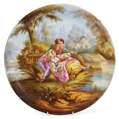 2395 - Victorian porcelain charger hand painted with a courting couple fishing, incised marks to the revers... 